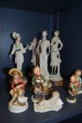 A selection of figures including Lladro and Nao