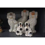 A selection of antique flat back Staffordshire dogs including pair of small spaniel dogs