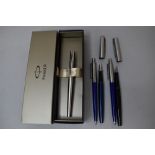 A boxed Parker stainless steel fountain pen and two modern Parker fountain pens, a Parker mechanical