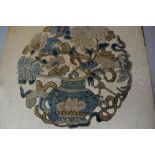 An antique needlework embroidery of a floral vase