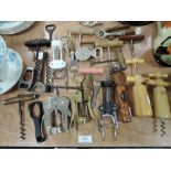 A selection of verious design corkscrews including antique examples