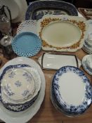 A selection of serving plates chargers and dishes including Couldon Churchill etc