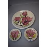 Two modern pin dishes by Moorcroft and a matching larger plaque or plate