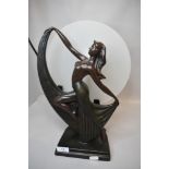 A modern art deco design lamp with dancing lady figure