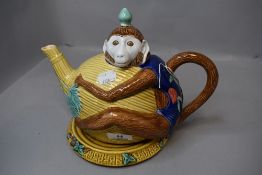 A novelty style tea pot in the form of a monkey