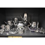 A selection of stainless steel kitchen wares including tea set and kettle