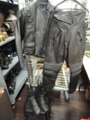 A Bellstaff motor cycle jacket and a pair of similar leather pants and boots