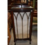 A 1920's mahogany narrow display cabinet having blind fret Greek key decoration, and claw and ball