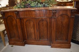 A Victorian mahogany sideboard having shaped front , width approx. 153cm