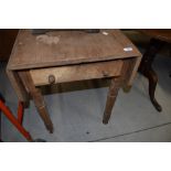 A Victorian stripped drop leaf kitchen table