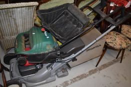 A Qualcast electric lawn scarifier, and a Honda HRB 475 petrol lawn mower