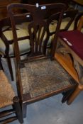 A period oak vase back chair having seagrass seat