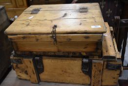 A pair of traditional lidded pine boxes having metal strapwork