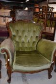 A reproduction Victorian style armchair having scroll frame and knurl legs
