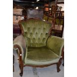 A reproduction Victorian style armchair having scroll frame and knurl legs