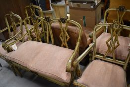 A French Louis XV style salon suite, comp, sofa and 4 armchairs, having distressed swag and scroll