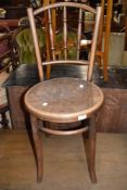 A traditional early 20th century stained frame bentwood chair