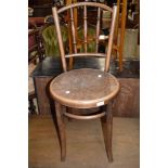 A traditional early 20th century stained frame bentwood chair