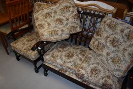 A late 20th century dark stained frame cottage suite, comp , setee and armchair with floral