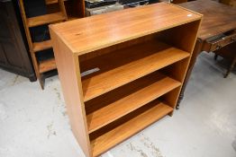 A vintage wood laminate bookcase, width approx. 82cm