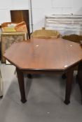 A late Victorian /Edwardian mahogany centre table having octaganal top on tapered legs, w 108cm