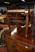 A late 20th century oak frame period style stool having sea grass top