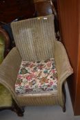 An early 20th century Lloyd Loom Lusty armchair