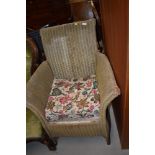 An early 20th century Lloyd Loom Lusty armchair