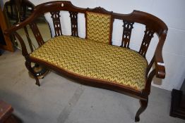 An Edwardian mahogany salon suite having shaped rail and line inlay decoration