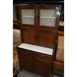 A vintage kitchenette, labelled 'neatette' frost glass top section over double cupboard, counter