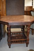 A late Victorian mahogany occasional/centre table having octagonal top with gallery undertier, w