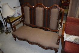 A Victorian style triple back settee having mahogany frame and modern upholstery, width approx.
