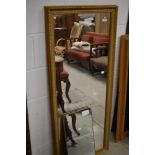 A gilt frame full length wall mirror, approx. 132 x 55cm