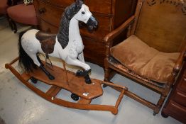 A traditional style child's rocking/pull along toy horse