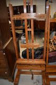A top quality Victorian adjustable golden oak easel , labelled J Bryce Smith, London (would
