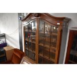 A nice quality early 20th Century mahogany bureau bookcase having ball and claw feet