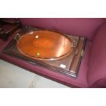 An Edwardian mahogany oval tray having shell inlay decoration and a trio set of graduated trays