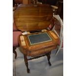 A 19th Century inlaid workbox having desk interior in typical turned frame