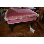 A reproduction footstool