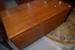 A vintage teak bedding chest