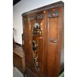 A 1920's 3 piece oak bedroom suite, comp, mirror door and drawer wardrobe, w 110cm, a chest of