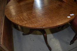A 19th Century oak snap top pedestal table