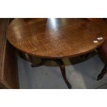 A 19th Century oak snap top pedestal table