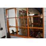 A 1970's design window mirror, w 109cm