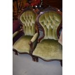 Two Victorian ladies and gents spoonback armchairs having scroll frames and knurl legs