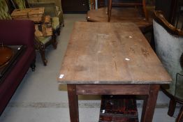 An early 20th century pine side table having rectangular top and square legs, w 108cm