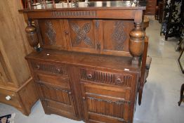 A mid to late 20th Century reproduction court cupboard , width approx. 120cm