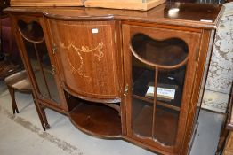 An Edwardian mahogany display cabinet base,having central bow and recess with sway inlay decoration,