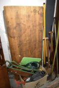 A Victorian pine utility folding table and a selection of garden tools