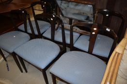 A set of six vintage dark stained chairs with upholstered seats, labelled for Uldum Mobelfabrik (